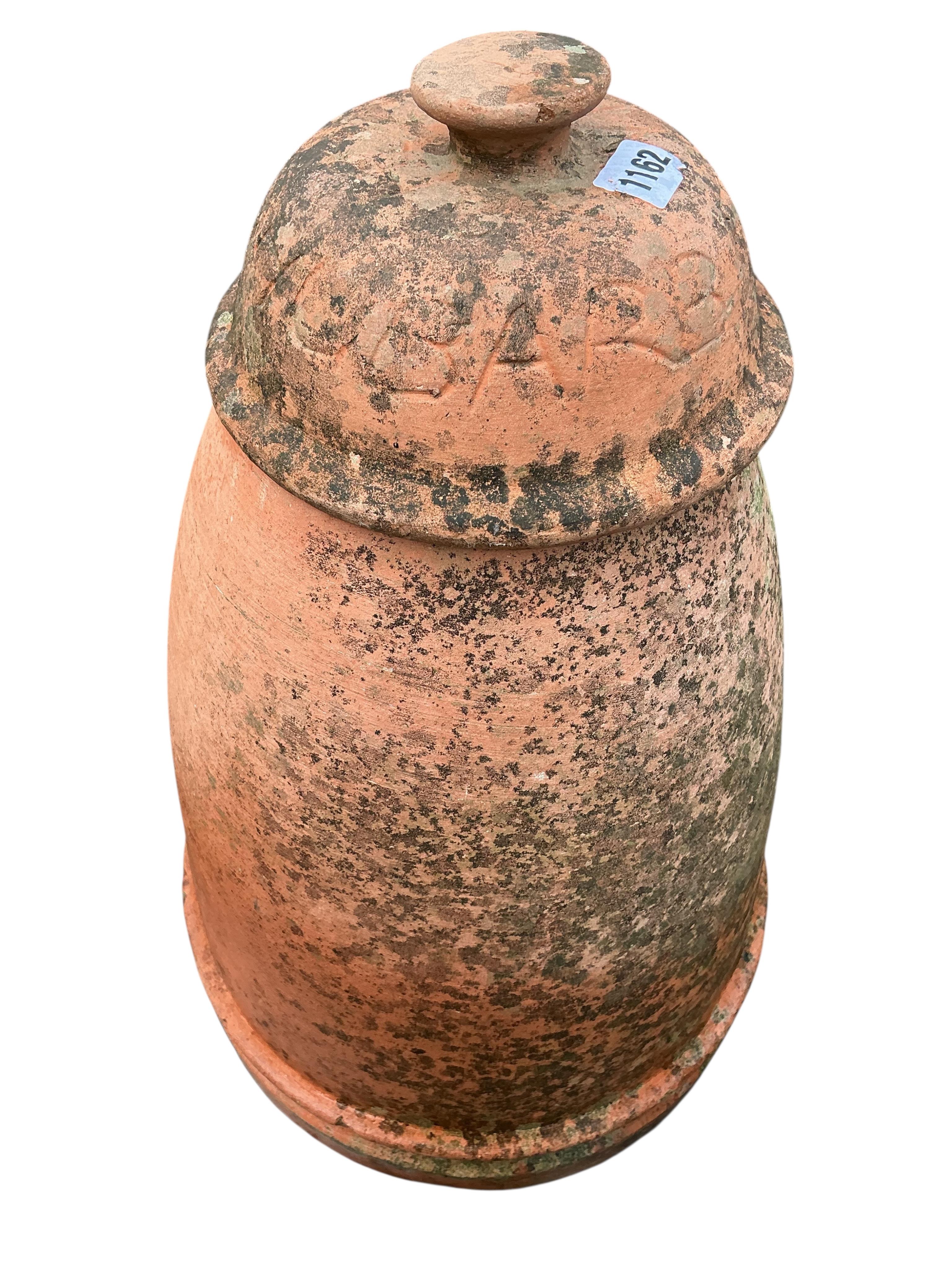 A circular terracotta rhubarb forcer and cover, height 54cm